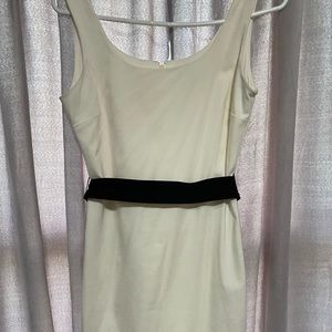 White la chateau dress with black belt.